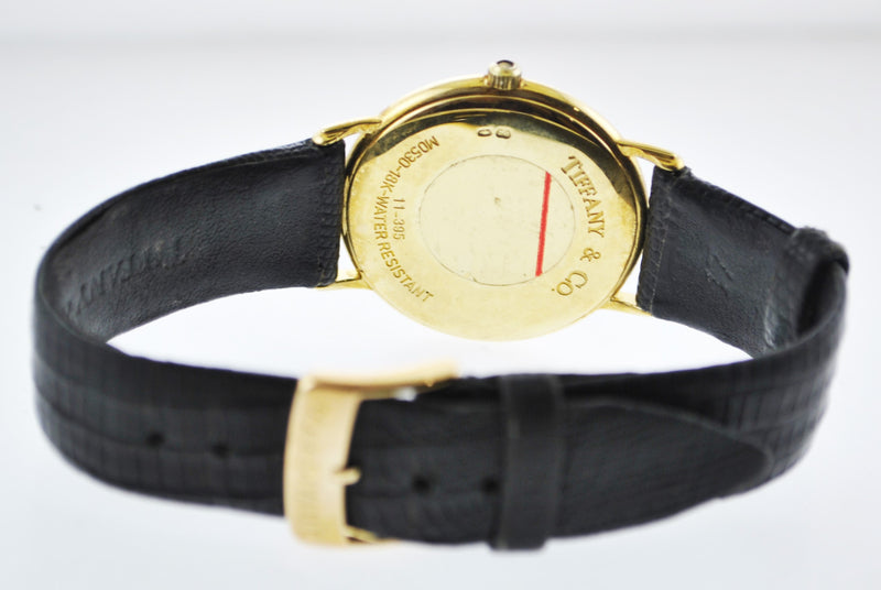 TIFFANY & CO. #M0530 Wristwatch Thin Round Case in 18K Yellow Gold on Black Leather Strap - $6K VALUE APR 57